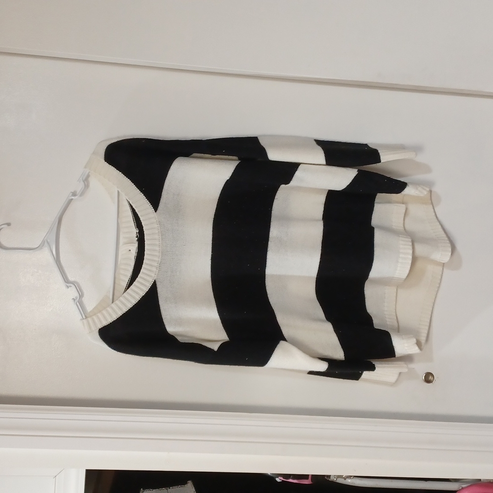 Black & White Sweater with Button's down the back.